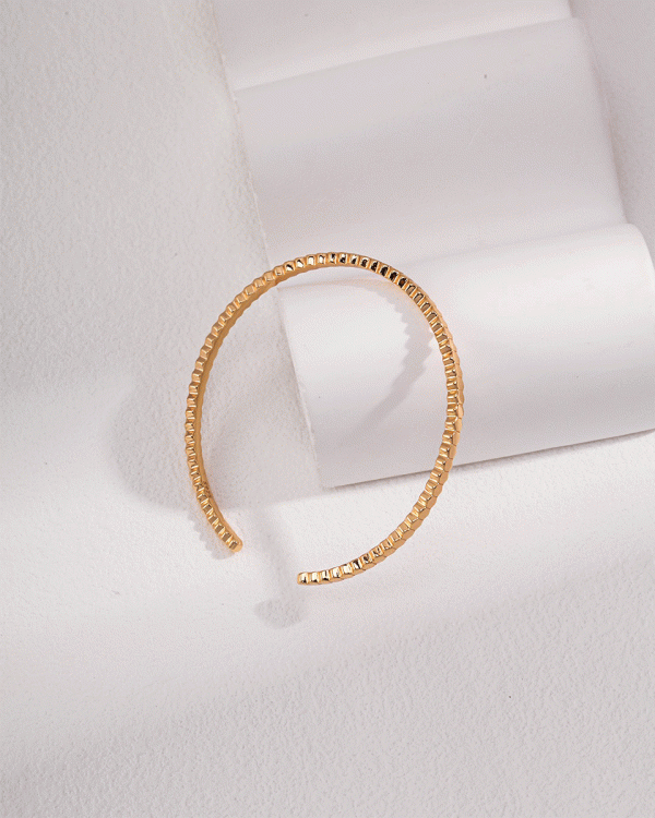 a silver/18K gold plated silver adjustable bracelet